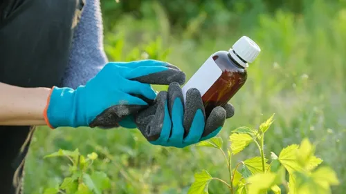 Agricultural chemical products including liquid pesticides and fertilizers packaged in leak-proof plastic bottles